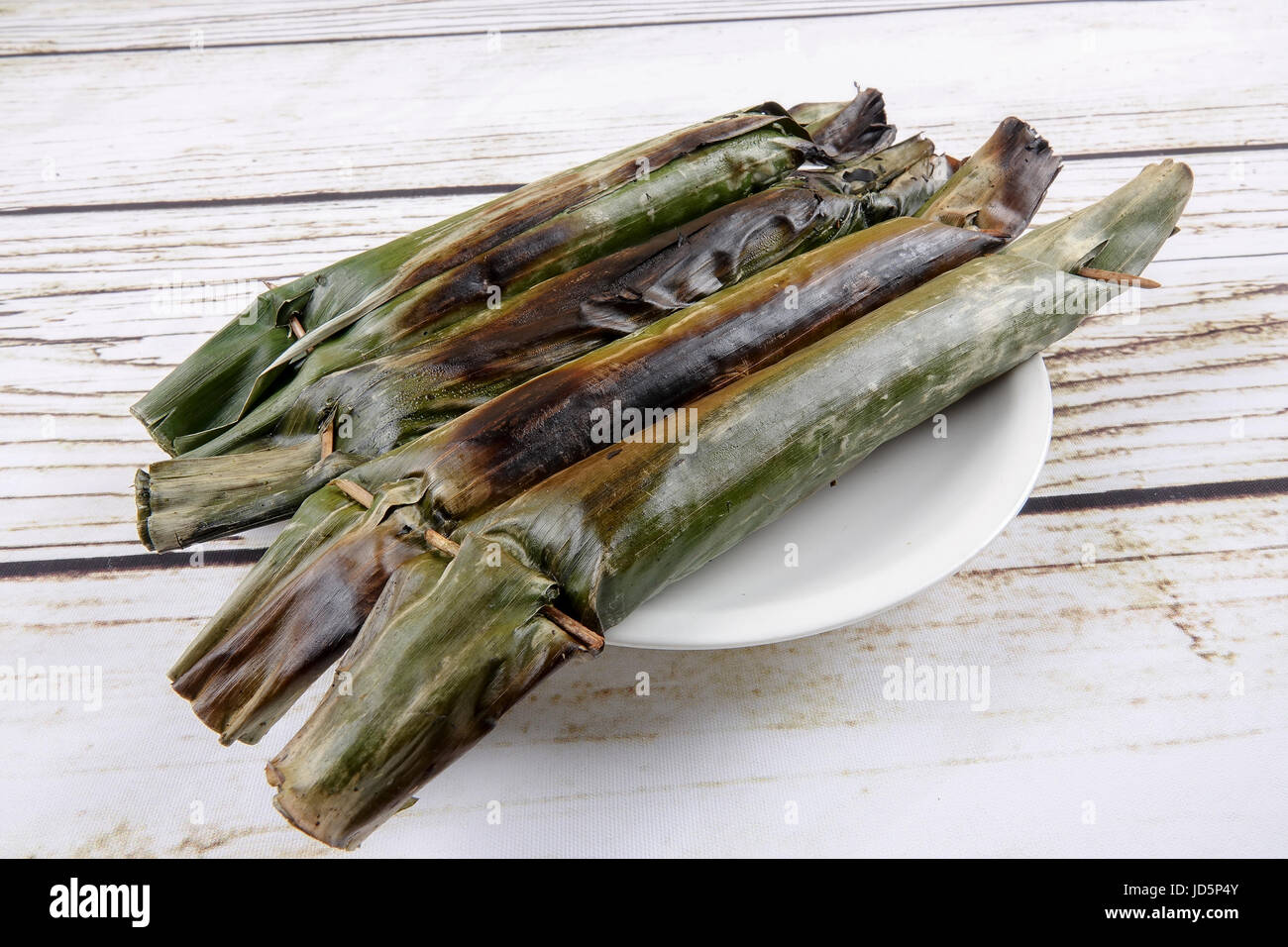 Pulut panggang or grilled glutinous rice package, Malay or Nonya cuisine most popular in Malaysia Stock Photo