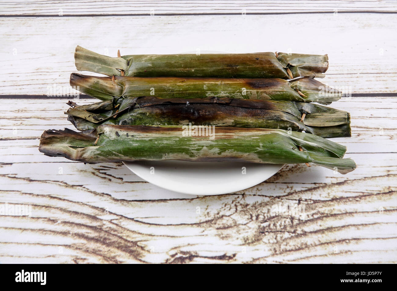 Pulut panggang or grilled glutinous rice package, Malay or Nonya cuisine most popular in Malaysia Stock Photo