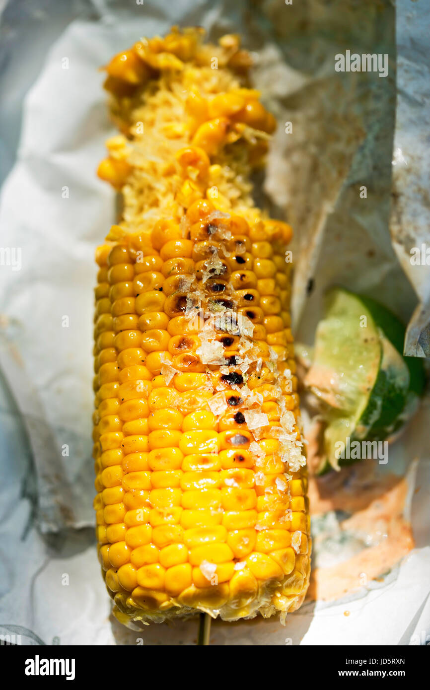 Mexican barbecued corn on the knob with Harissa mayo and lime Stock
