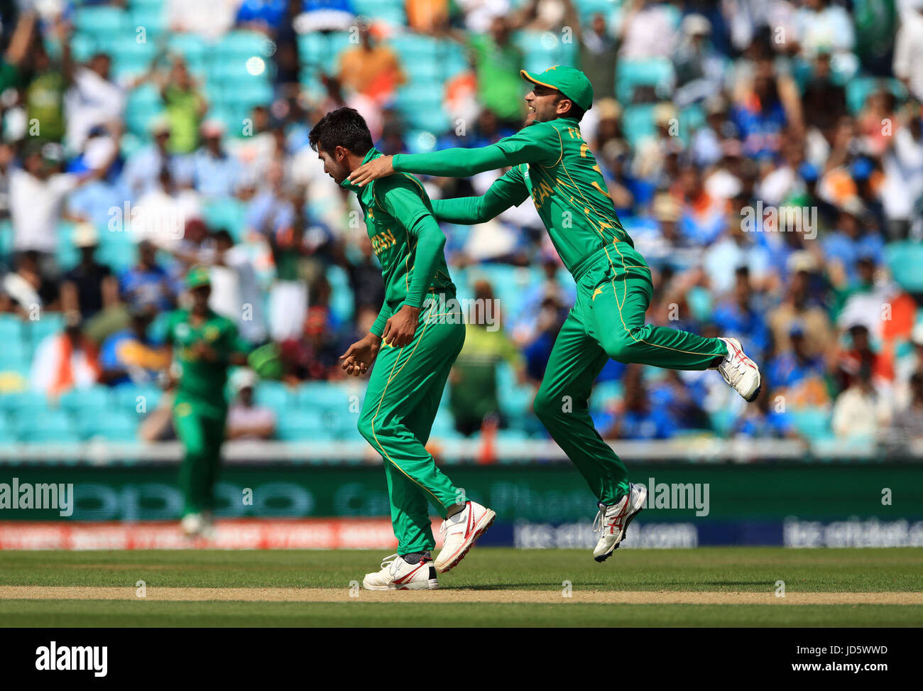 Pakistan's Mohammad Amir (left) celebrates the wicket of India's Rohit ...