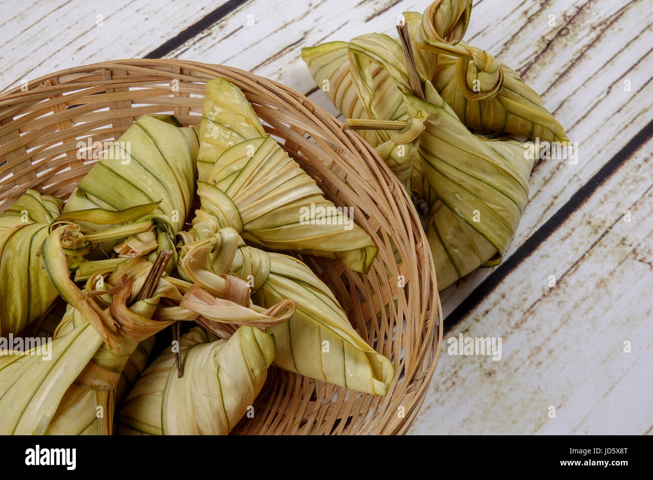 Ketupat (Rice Dumpling) On wooden Background. Ketupat is a natural rice ...
