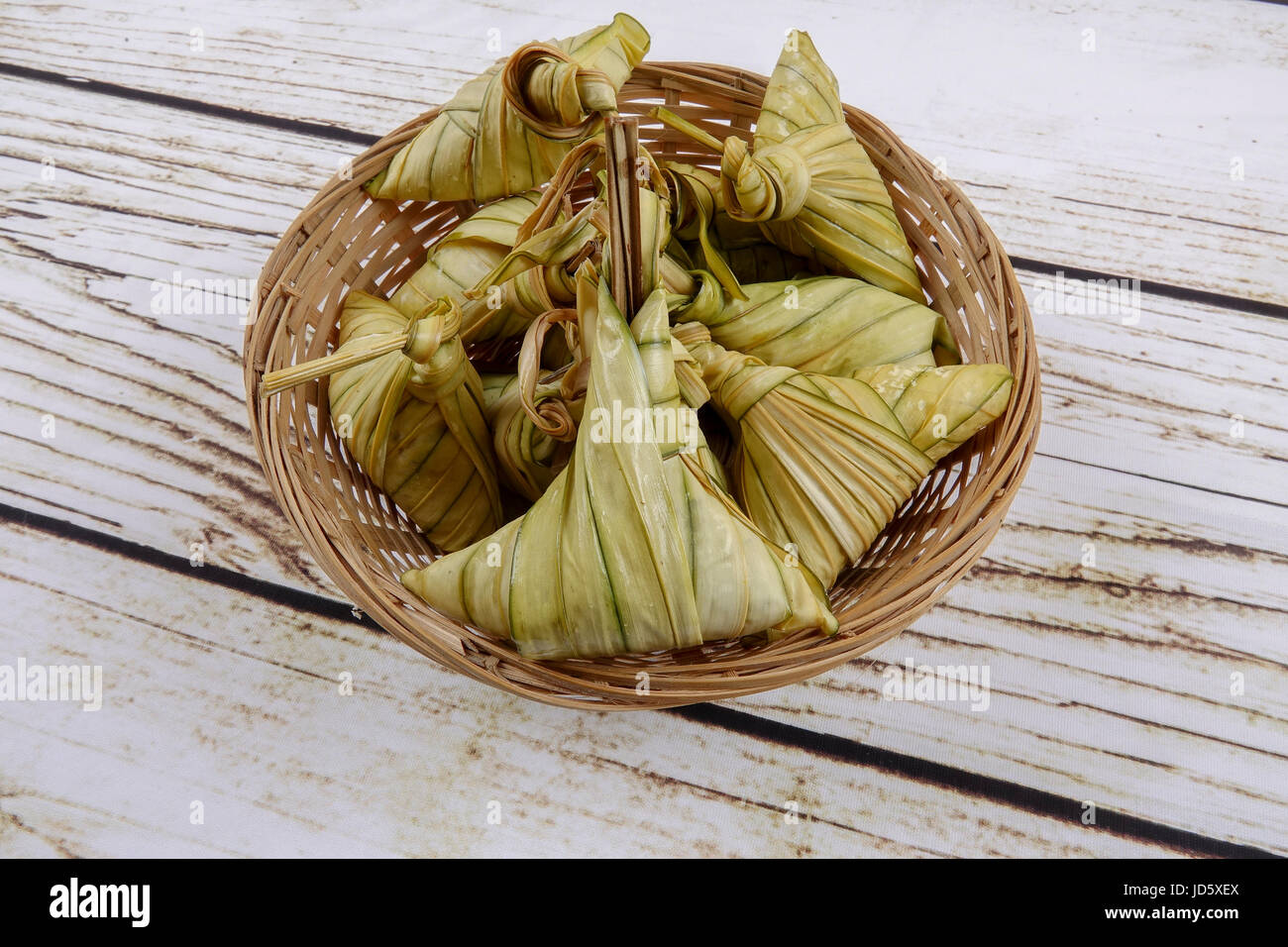 Ketupat (Rice Dumpling) On wooden Background. Ketupat is a natural rice ...