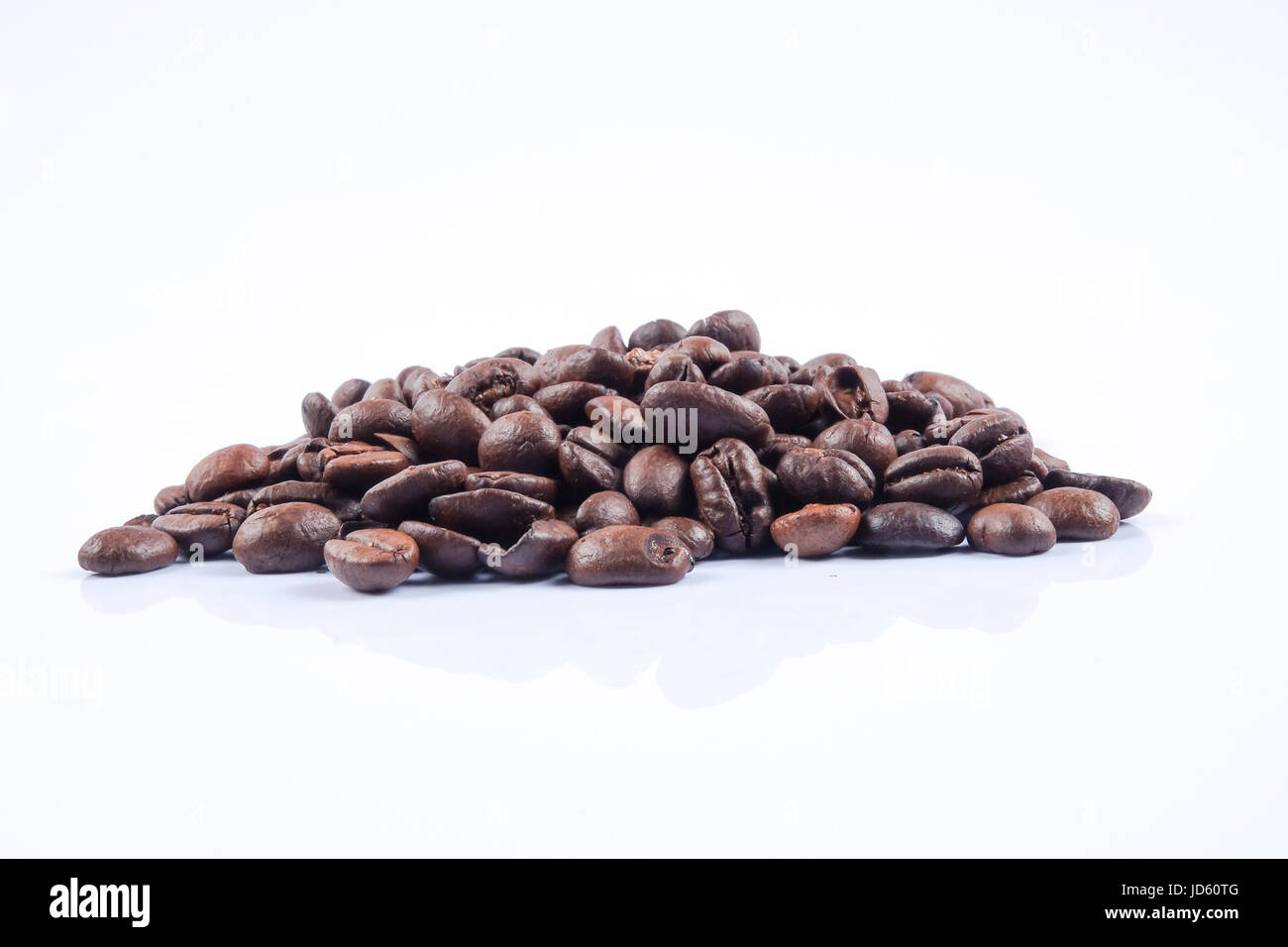 roasted coffee beans isolated in white background Stock Photo - Alamy