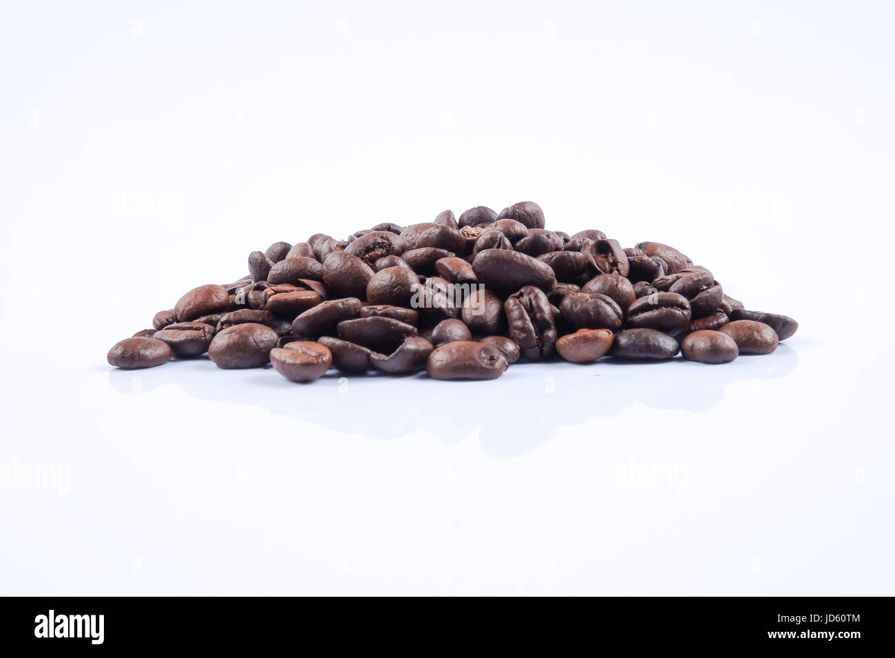 roasted coffee beans isolated in white background Stock Photo - Alamy