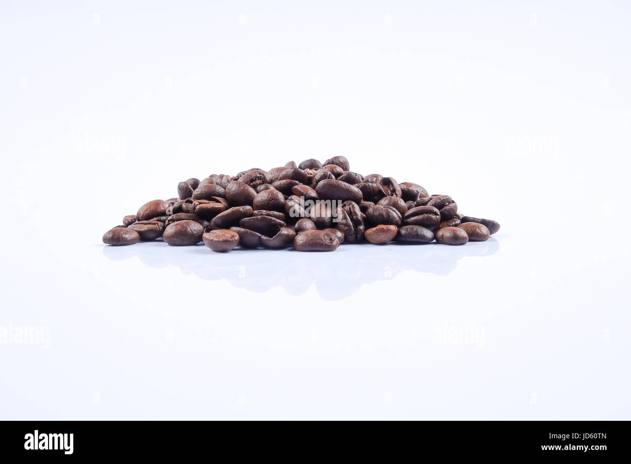 roasted coffee beans isolated in white background Stock Photo - Alamy