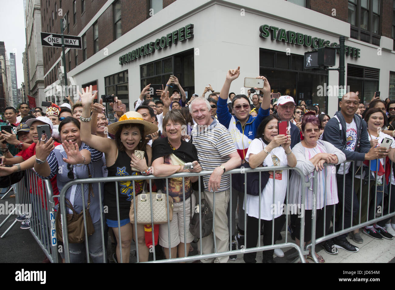 Philippine Independence Day Parade along Madison Avenue in New York City. Filipino American spectators at the parade. Stock Photo