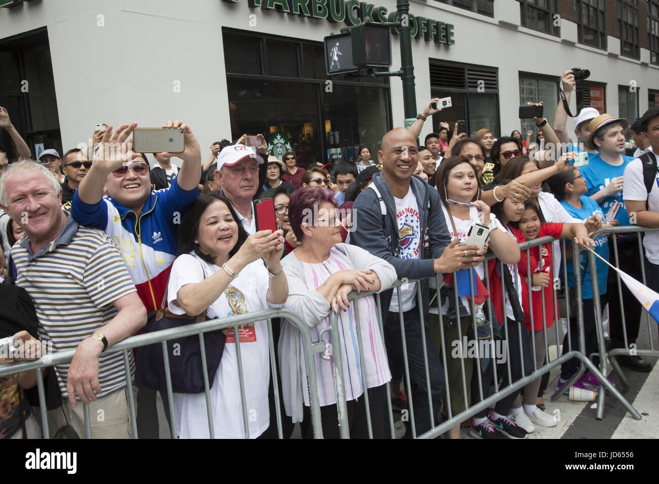 Philippine Independence Day Parade along Madison Avenue in New York City. Filipino American spectators at the parade. Stock Photo
