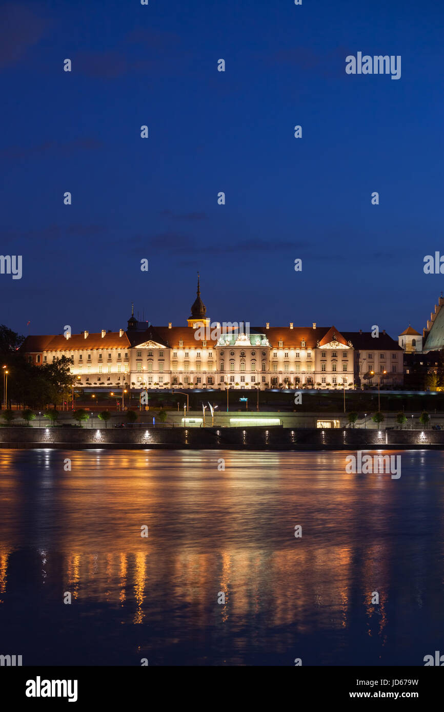 Royal Castle in city of Warsaw, Poland illuminated at night, view across Vistula River, Baroque and Mannerist architecture Stock Photo