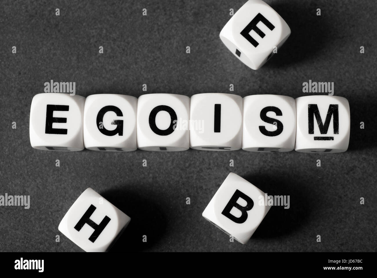 word egoism on white toy cubes Stock Photo
