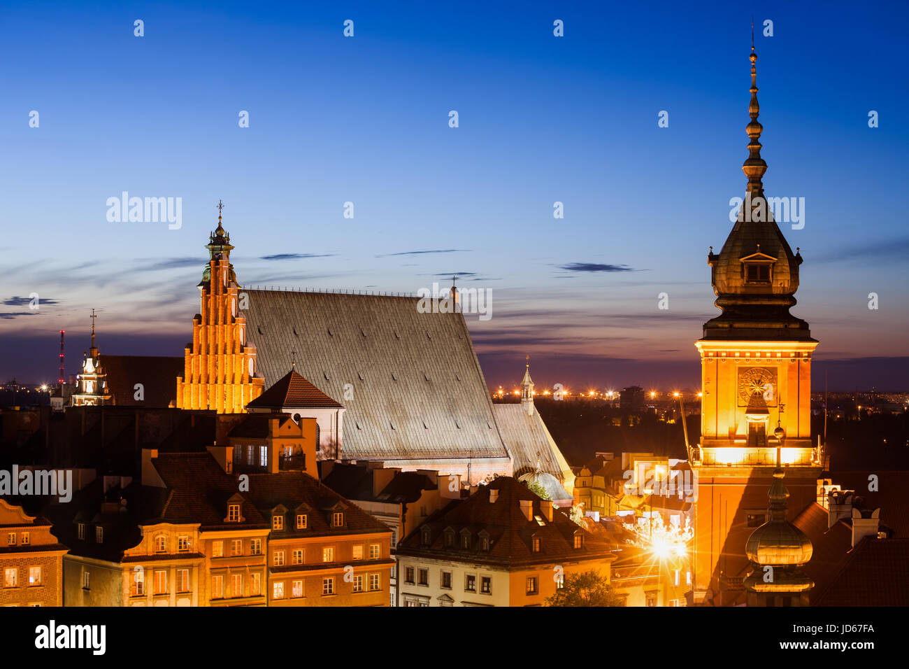 Old Town of Warsaw skyline at twilight in Poland, Royal Castle clock tower, historic houses and St. John's Archcathedral, city landmark Stock Photo