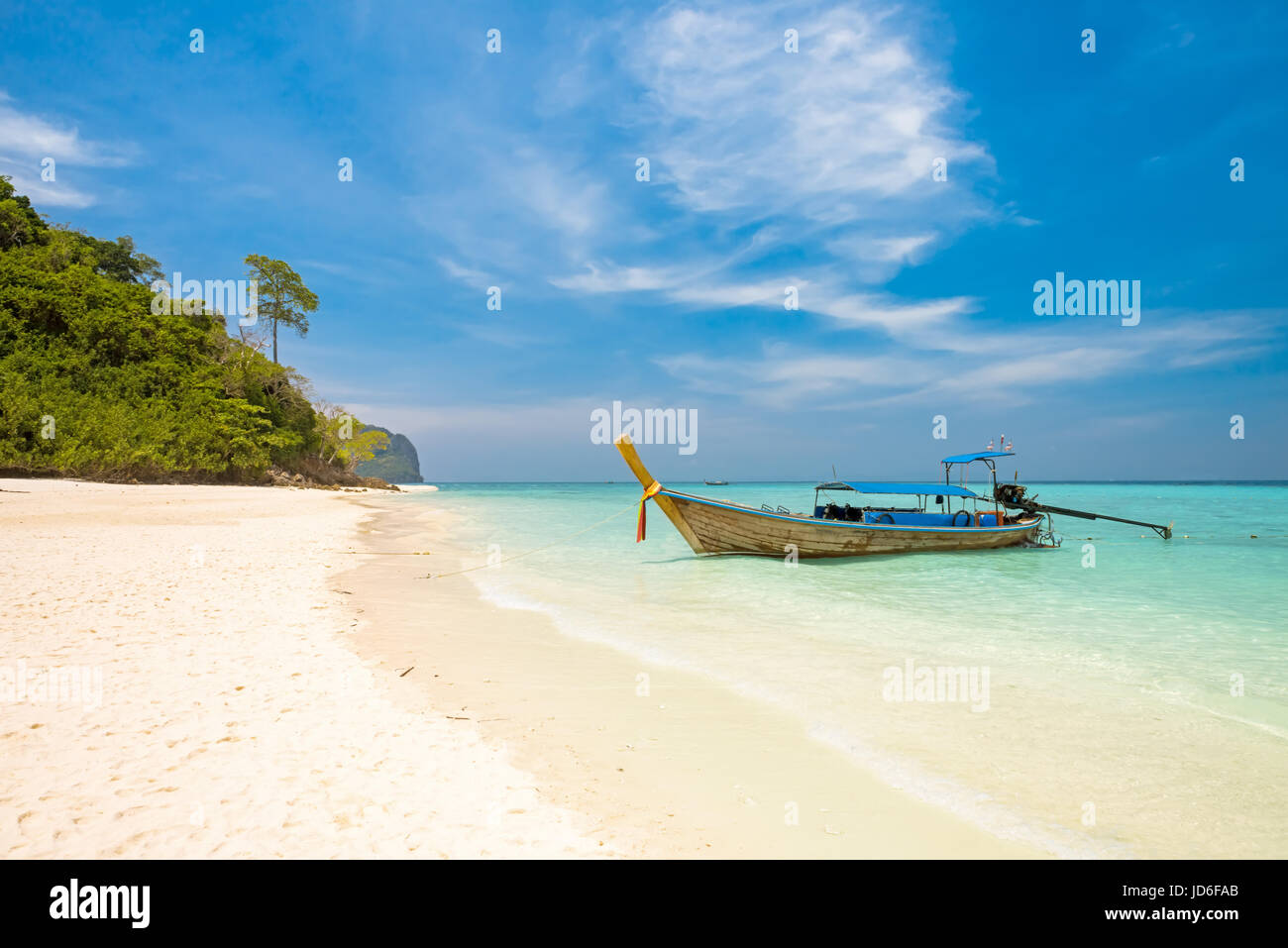 Koh Bamboo island bay and longtail boat, Andaman Sea - Thailand Stock Photo