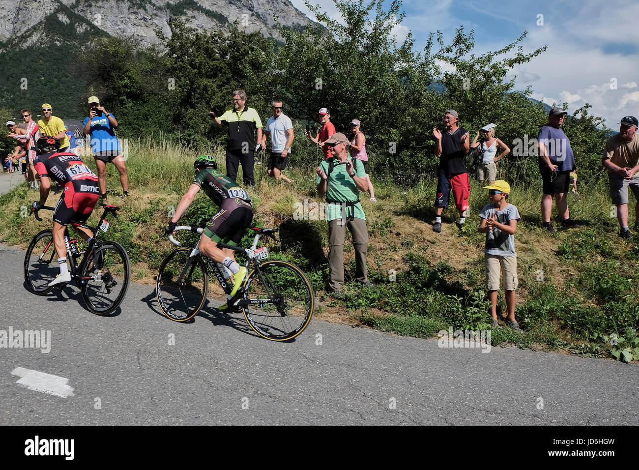 MONTVERNIER, FRANCE - JULY 23, 2015: Damiano Caruso BMC Racing Team and Cyril Gautier team Europcar riding together up the mountain roads at Montverni Stock Photo