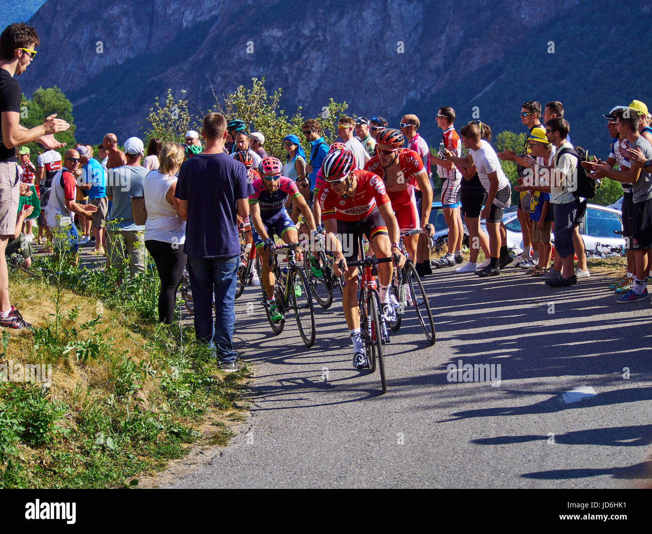 MONTVERNIER, FRANCE - JULY 23 2015: riders in a road turn with spectators on stage 18 in Tour de France 2015 Stock Photo