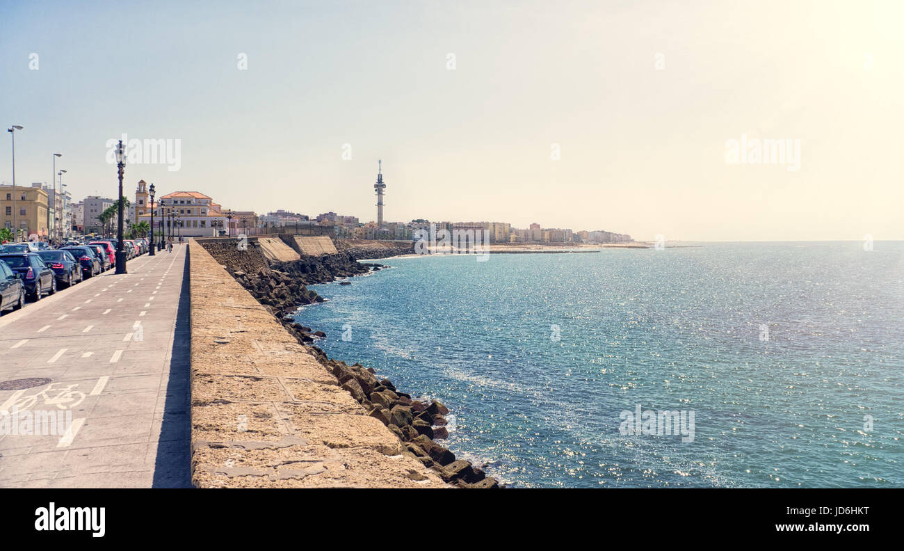The waterfront of Cadiz city in Spain with a view of the boardwalk along the sea in Sunny day. Stock Photo
