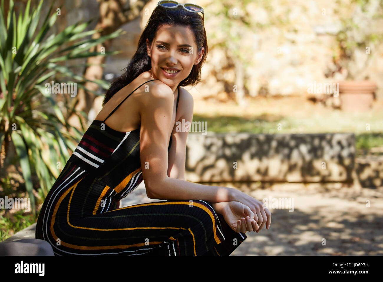 Beautiful woman resting in the summer the Italian garden Stock Photo