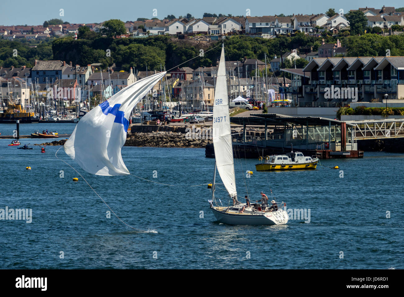 A spinnaker almost gets loose after flying in Plymputh Sound. Stock Photo