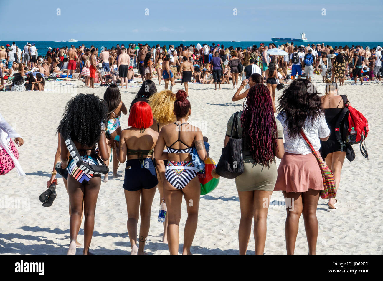 Miami Beach Florida,Atlantic Ocean,Spring Break,sand,Black man men male,woman female women,crowd,young adult,college students,social gathering,urban,b Stock Photo