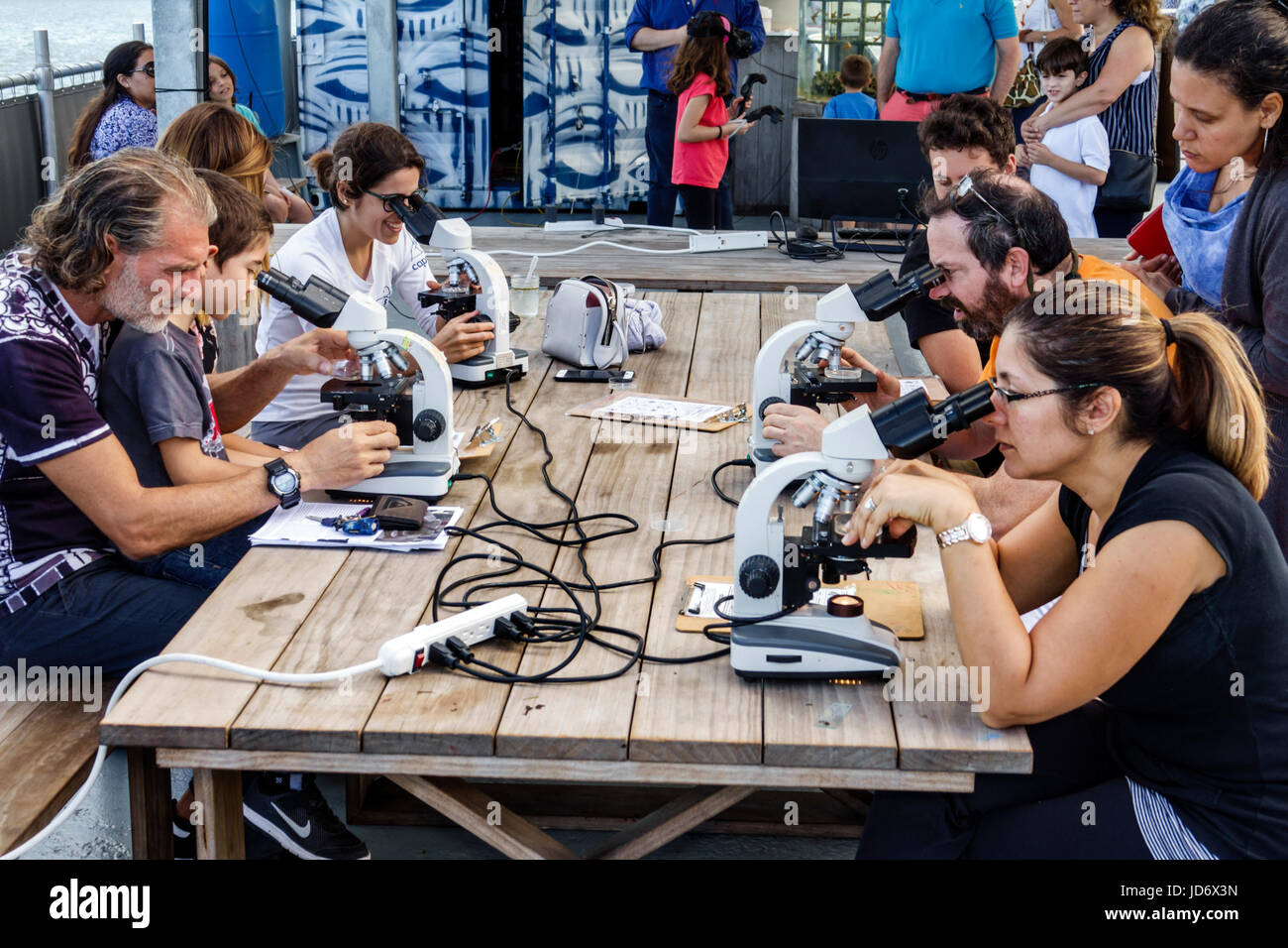 Miami Florida,Downtown,Museum Park,Miami Science Barge,floating marine laboratory,al education exhibit,microscope,woman female women,man men male,boy Stock Photo