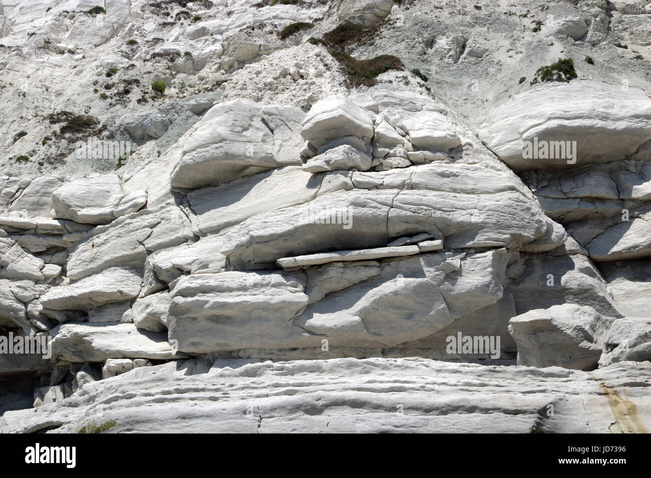 Beachy Head, East Sussex, UK. 18th June 2017. Unusual rock formations ( Jabba The Hut) in the chalk cliff beneath Beachy Head in East Sussex, where a 12.30 low tide enabled safe access to the beach, foreshore and iconic lighthouse. Credit: Julia Gavin UK/Alamy Live News Stock Photo