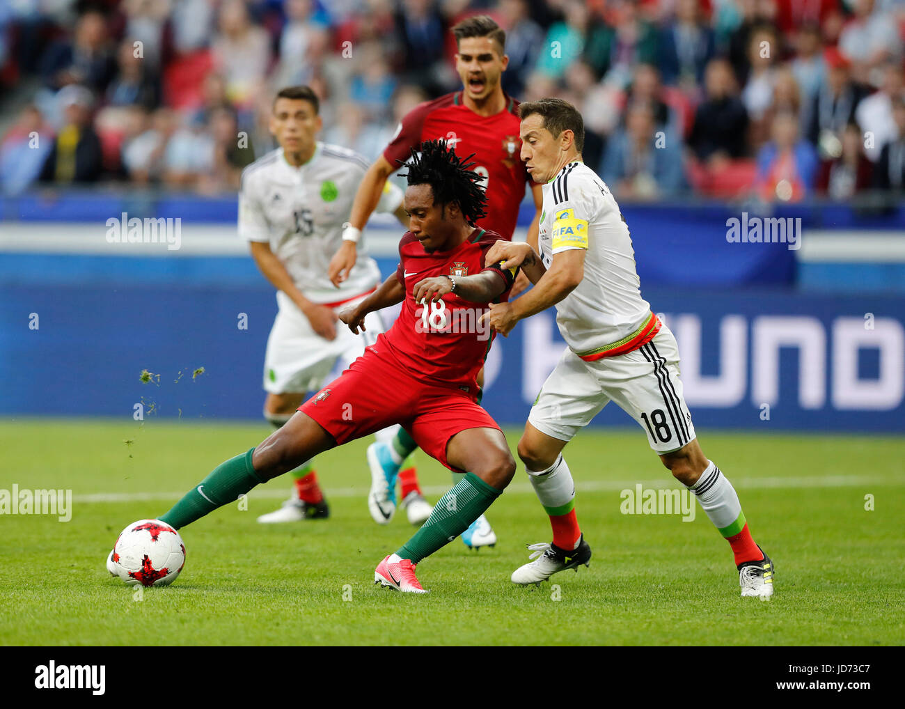 KAZAN, RT - 18.06.2017: PORTUGAL VS. MEXICO - GUARDADO Andres de México plays the ball with GELSON MARTINS of Portugal during a match between Portugal and Mexico valid for the first round of the Confederations Cup 2017 on Sunday (18) held at the Kazan Arena in Kazan, Russia. (Photo: Rodolfo Buhrer/La Imagem/Fotoarena) Stock Photo