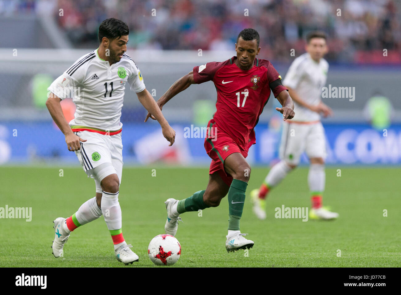 Kazan, Russia. 18th June, 2017. Portugal's Nani (front R) vies with Mexico's Carlos Vela during the 2017 Confederations Cup Group A football match in Kazan, Russia, on June 18, 2017. Credit: Bai Xueqi/Xinhua/Alamy Live News Stock Photo