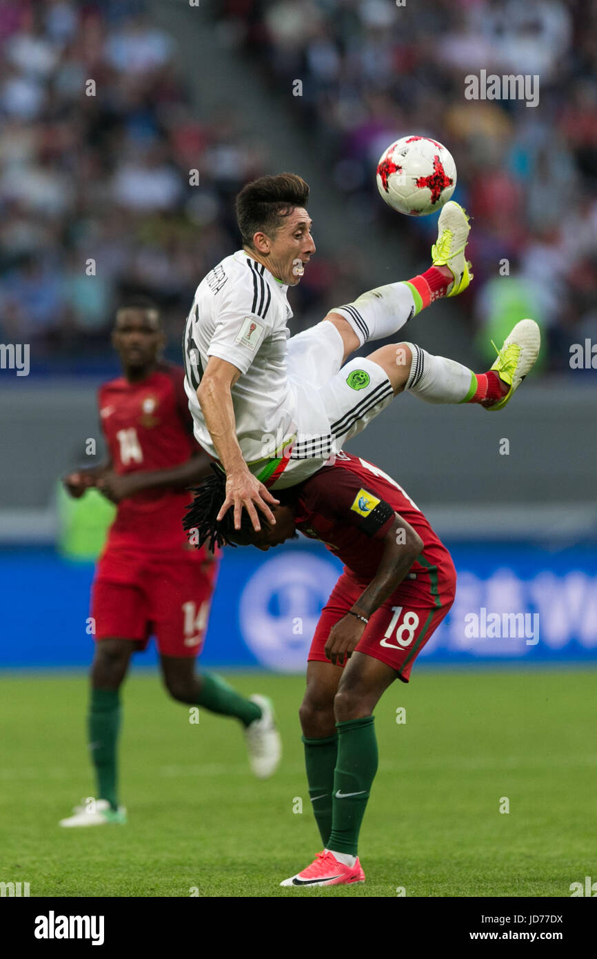 Kazan, Russia. 18th June, 2017. Portugal's Gelson Martins (bottom) vies with Mexico's Hector Herrera during the 2017 Confederations Cup Group A football match in Kazan, Russia, on June 18, 2017. Credit: Bai Xueqi/Xinhua/Alamy Live News Stock Photo