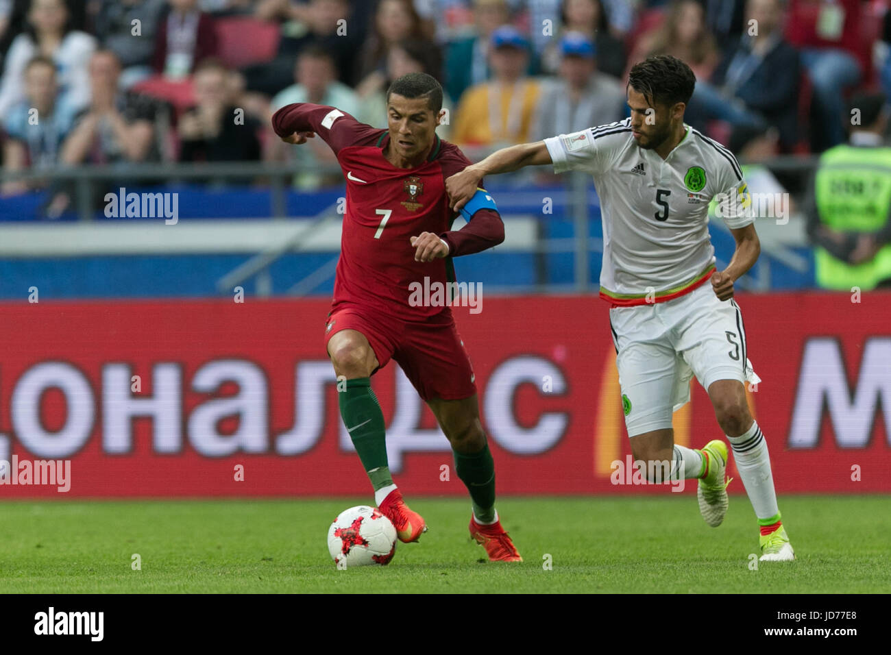 Kazan, Russia. 18th June, 2017. Portugal's Cristiano Ronaldo (L) vies with Mexico's Diego Reyes during the 2017 Confederations Cup Group A football match in Kazan, Russia, on June 18, 2017. Credit: Bai Xueqi/Xinhua/Alamy Live News Stock Photo