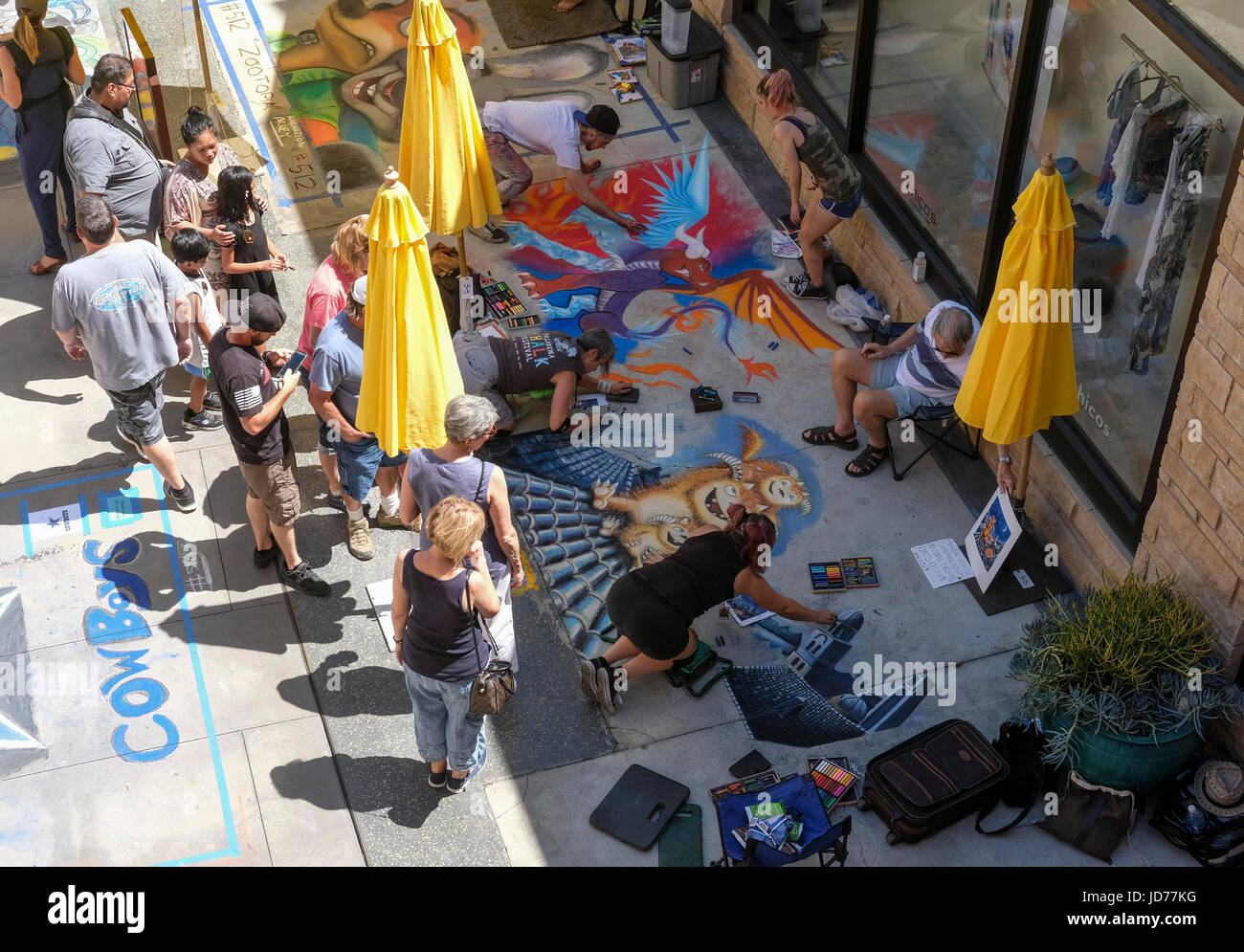 Los Angeles, USA. 18th June, 2017. Artists work on their pieces during the 25th annual Pasadena Chalk Festival in Los Angeles, the United States, June 18, 2017. Hundreds artists used more than 25,000 sticks of pastel chalk to create life-size murals on the city pavement. Credit: Zhao Hanrong/Xinhua/Alamy Live News Stock Photo