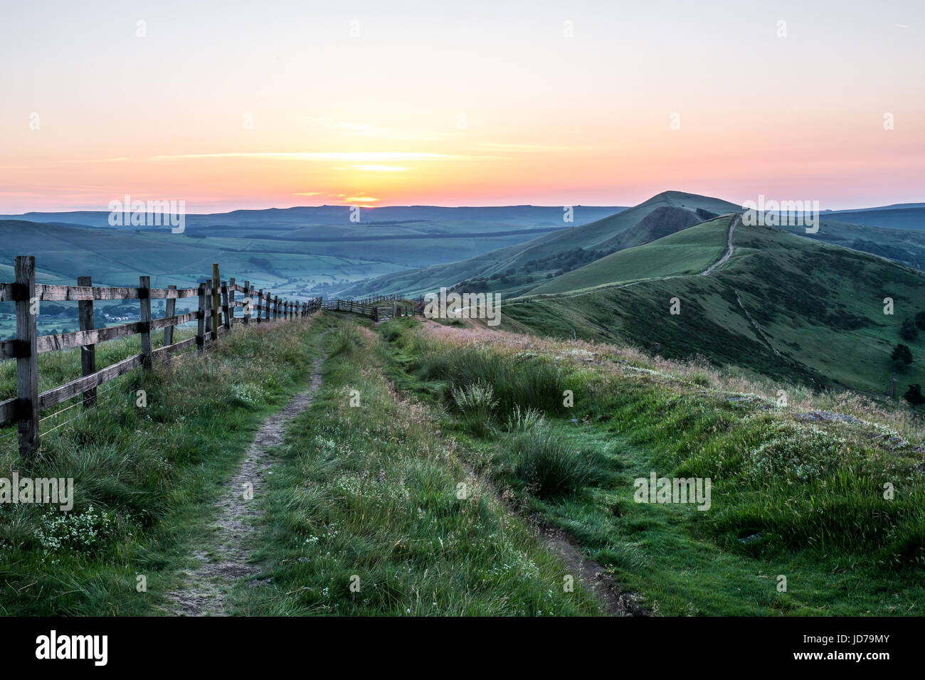 A colourful sunrise over Mam Tor ridge. Mam Tor, Peak District National ...