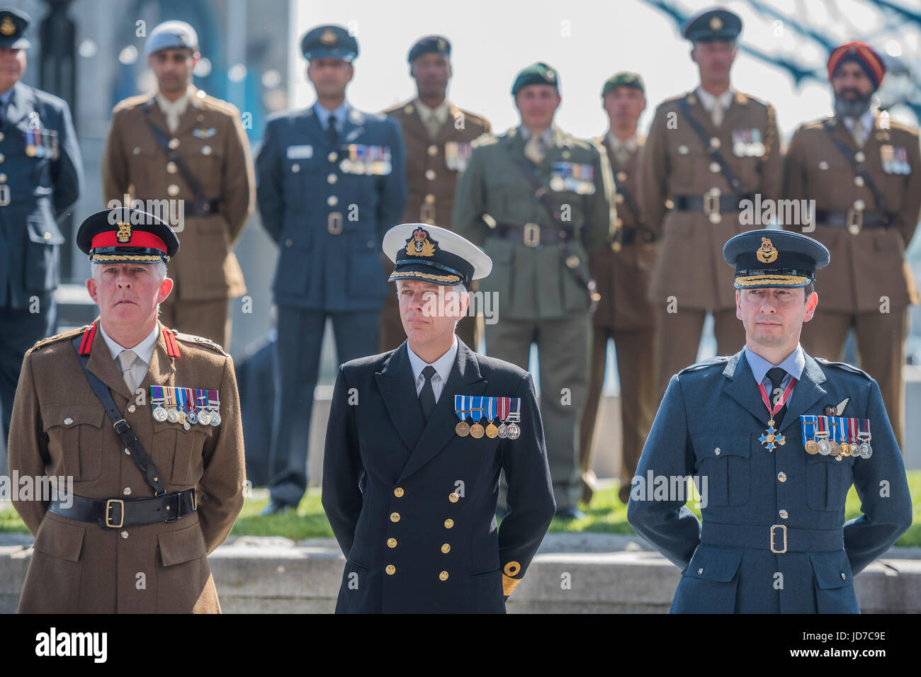 Brigadier Michael McGovern, Commodore David Elford and Air Commodore Richard Barrow - On behalf of the Mayor Sadiq Khan (who was called to a security meeting), The Deputy Mayor of London, Joanne Mcartney, was joined by members of the London Assembly, the Royal Navy, Army and Royal Air Force for a flag raising ceremony to show support for the men and women who make up the Armed Forces community. Accompanied by music from the Band of the Scots Guards, a British Armed Forces flag was raised outside City Hall, in the lead up to Armed Forces Day next Saturday Stock Photo