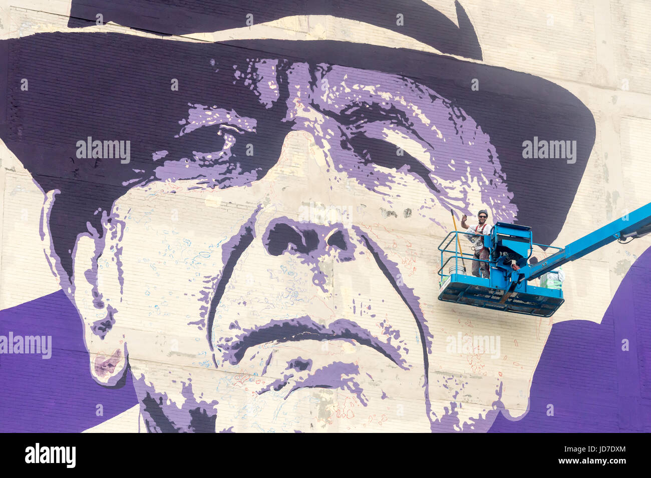 Montreal, Canada. 18th June 2017. Artist Kevin Ledo paints Leonard Cohen Mural at the corner of Saint-Dominique and Napoleon Street Credit: Marc Bruxelle/Alamy Live News Stock Photo
