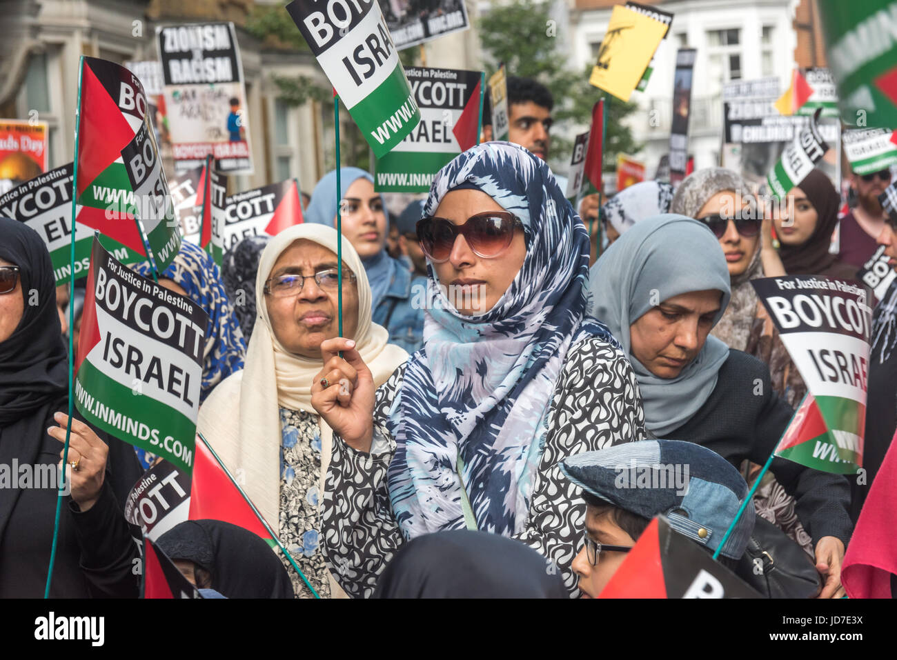 London, UK. 18th June, 2017. London, UK. 18th June 2017. Women on the annual Al Quds (Jerusalem) Day march in London was attended by several thousand from all over the country. Organised by Quds committee with the Islamic Human Rights Commission and supported by various groups including the Stop the War Coalition, Muslim Association of Britain and Jews for Boycotting Israeli Goods was led by Imams and Neturei Karta anti-Zionist Jews, it called for Freedom for Palestine and for all oppressed people's across the world. As usual in attracted opposition from Zionist groups, with a rally being hel Stock Photo