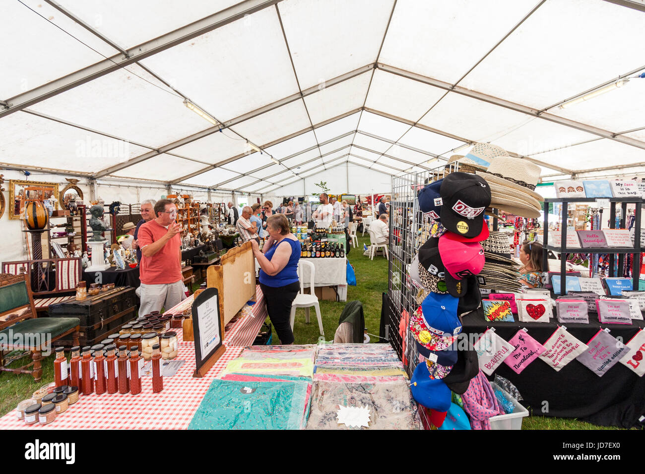 Tented area with arts and crafts market. Various stalls set up selling