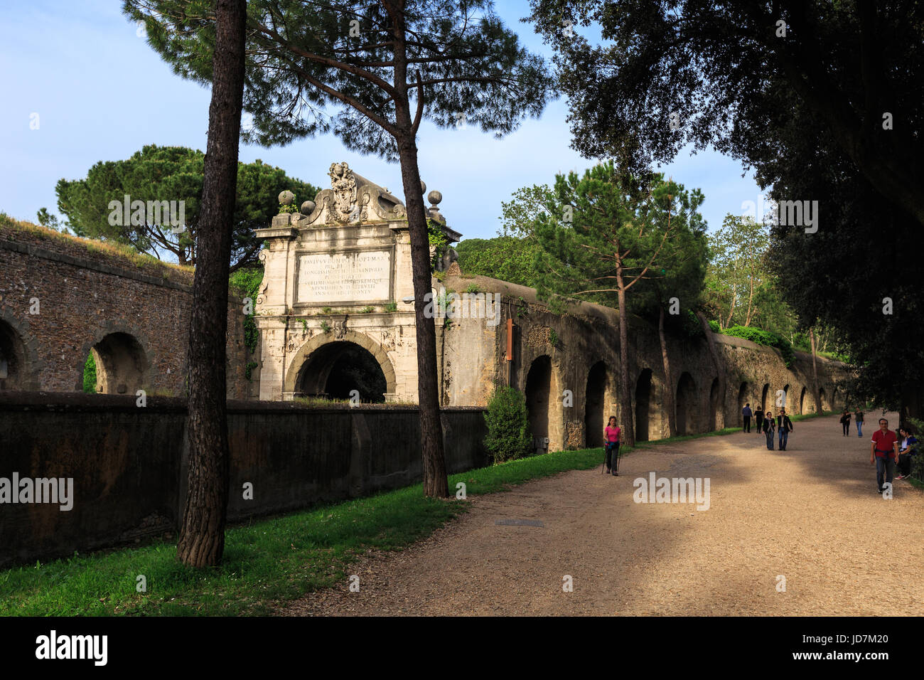 People walks along Aurelian wall around Ancient Rome on Aurelia Antica street Stock Photo