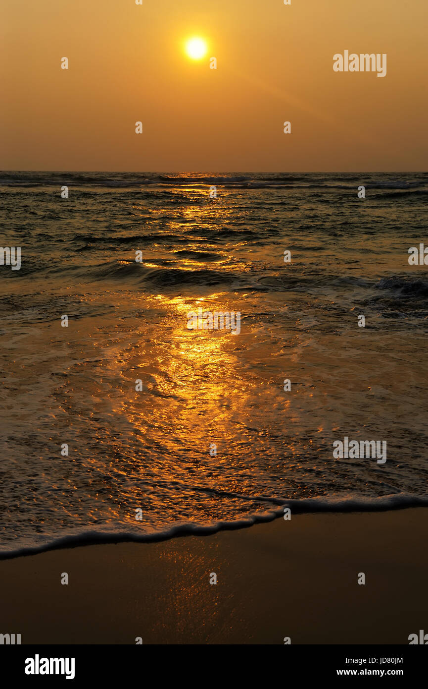 Beautiful tropical sunset in golden beach Stock Photo - Alamy