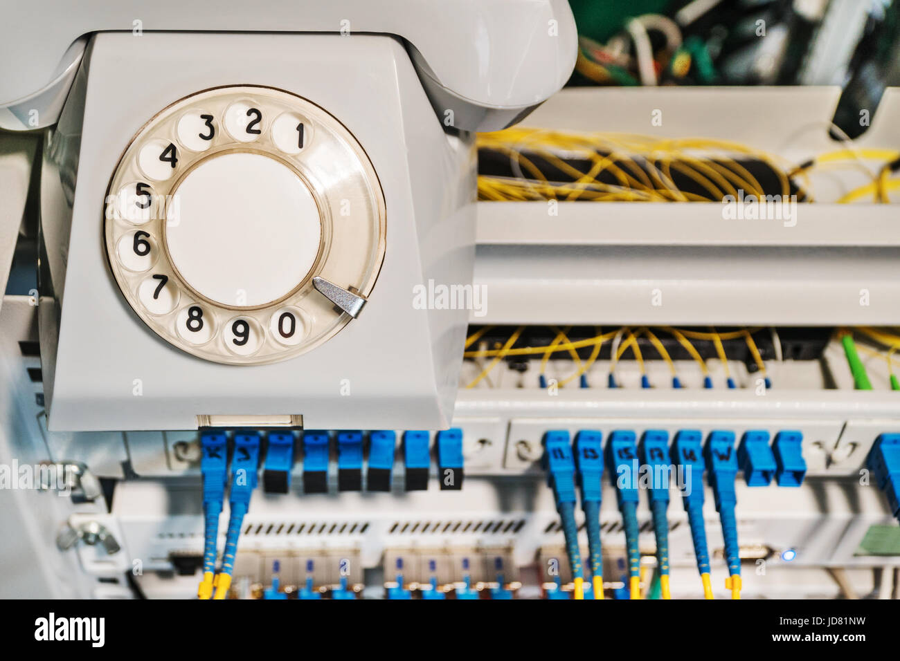 Phone Router Red Old Conceptual photo - old retro phone on a rack with internet routers ...