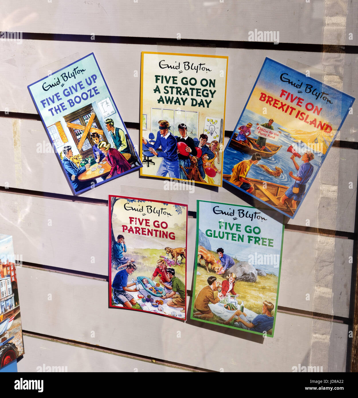 Humourous new editions of Enid Blyton's Famous Five books, including Five go Gluten Free and Five Give up the Booze Stock Photo