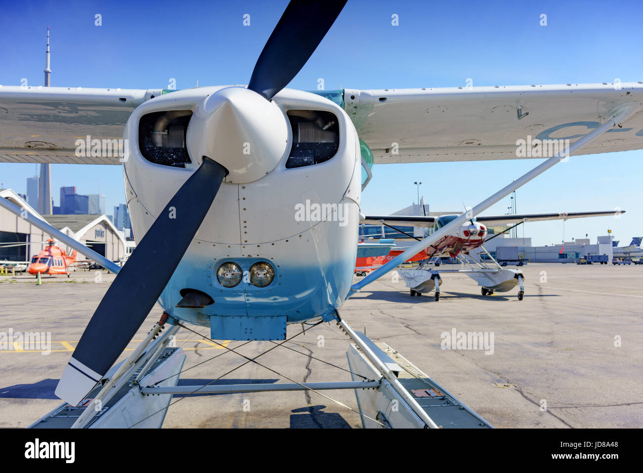 Close up of float plane on runway with helicopter and float plane in background. aerial picture from ontario canada 2016 Stock Photo