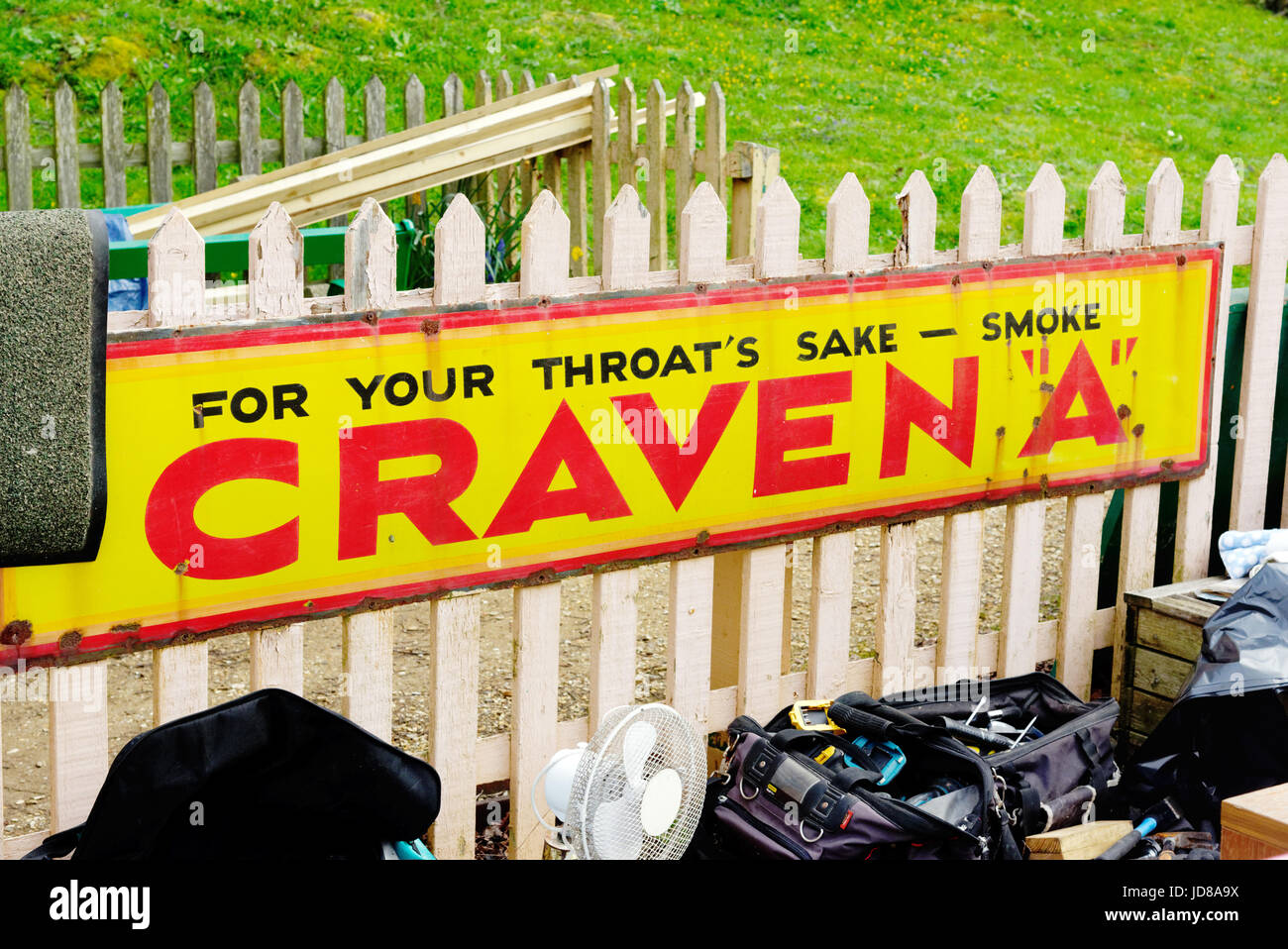 An old advertisement for Craven A Cigarettes with the astounding catchline For Your Throat's Sake Smoke Craven A Stock Photo