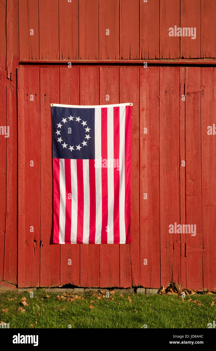 Close up United States flag on a red vintage barn, Monroe Township,New Jersey, US flag Betsy Ross, 13 Stars and Stripes, colonial American farming pt Stock Photo