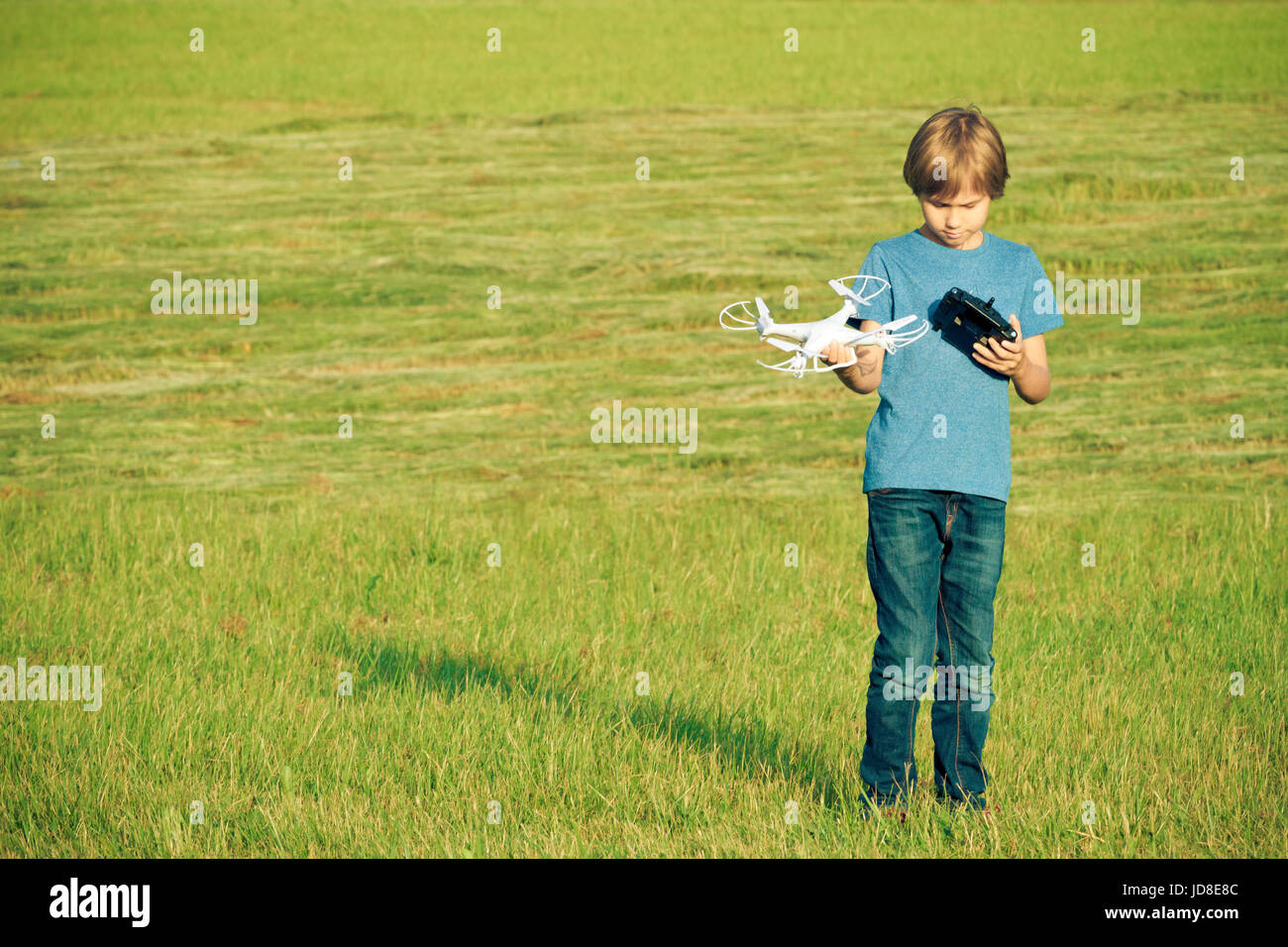 Little boy playing with drone in summer day outdoors Stock Photo - Alamy