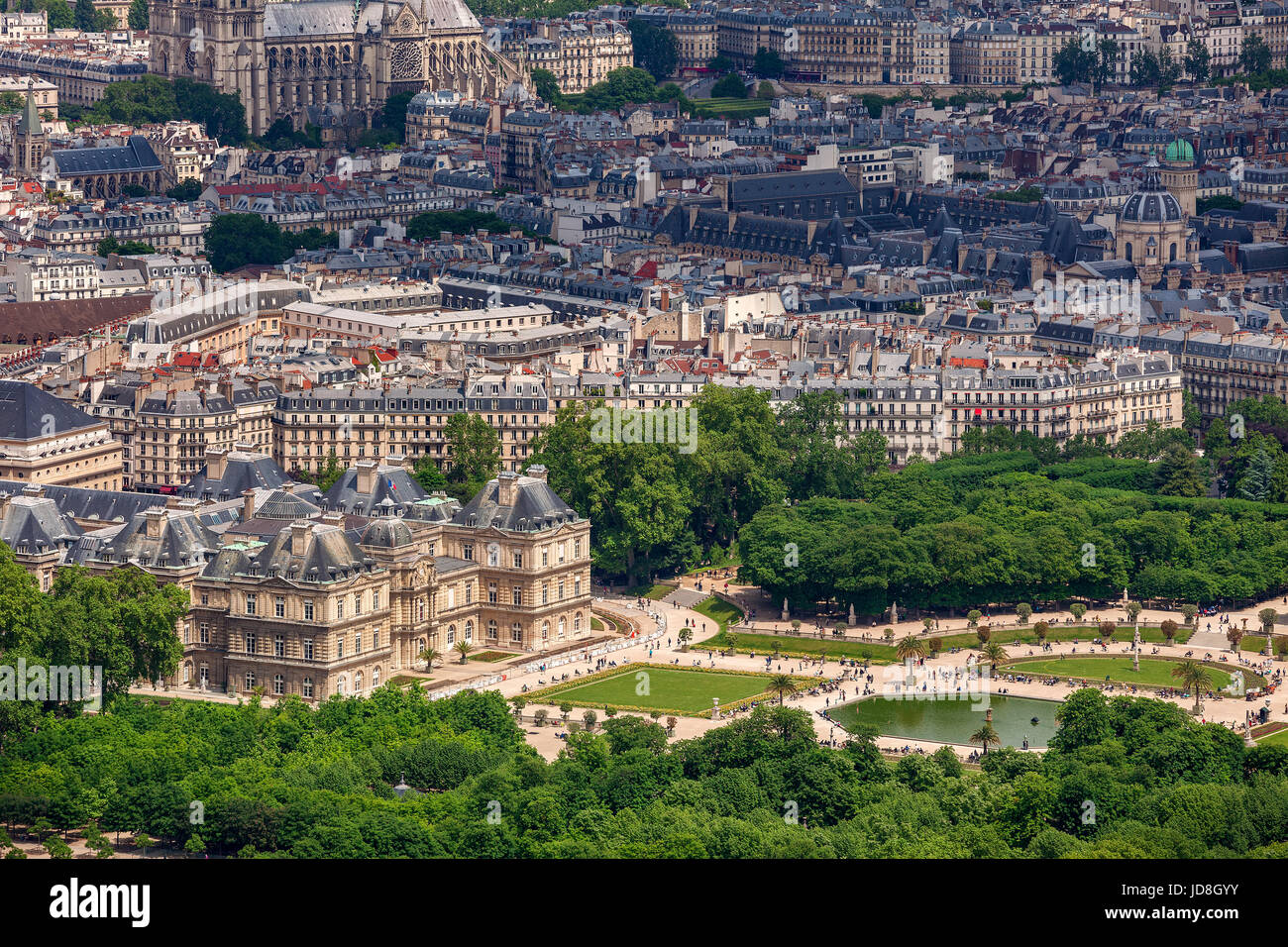View from above on famous garden Jardin du Luxembourg and  Luxembourg Palace as typical parisian buildings on background in Paris, France. Stock Photo