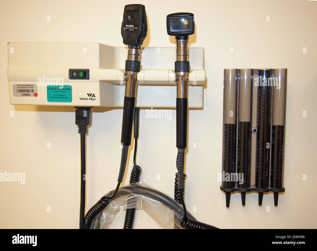 Otoscope and speculums on wall  of exam room Stock Photo