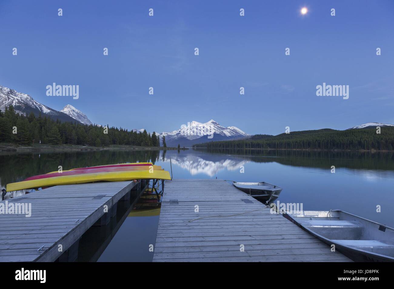Full Moon Rising over Maligne Lake Night Landscape View. Canoe Rental