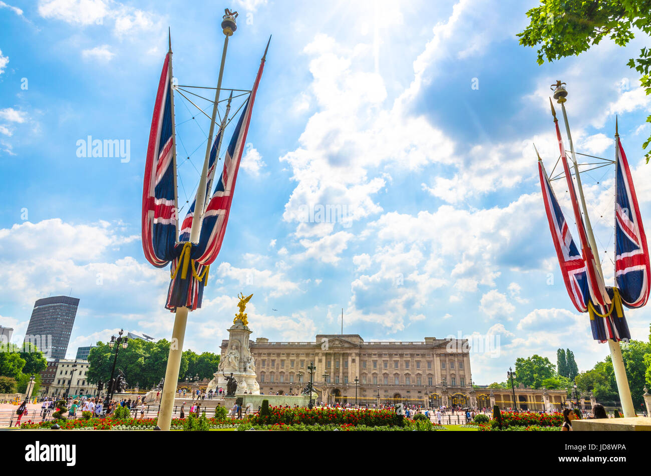 The Union Jack flags at Buckingham Palace against bright summer clouds Stock Photo