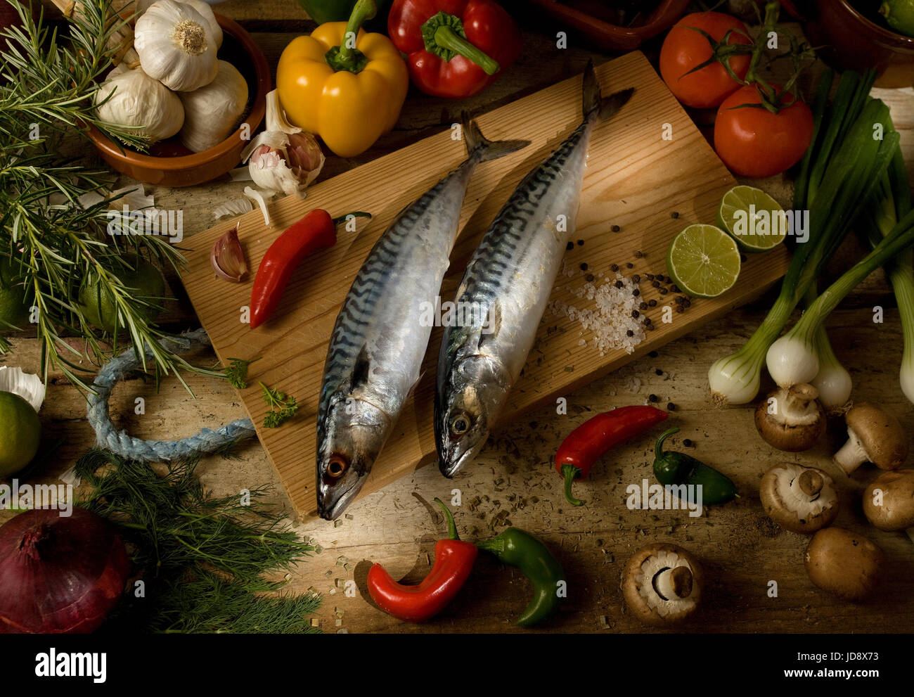 whole uncooked mackerel with raw ingredients Stock Photo