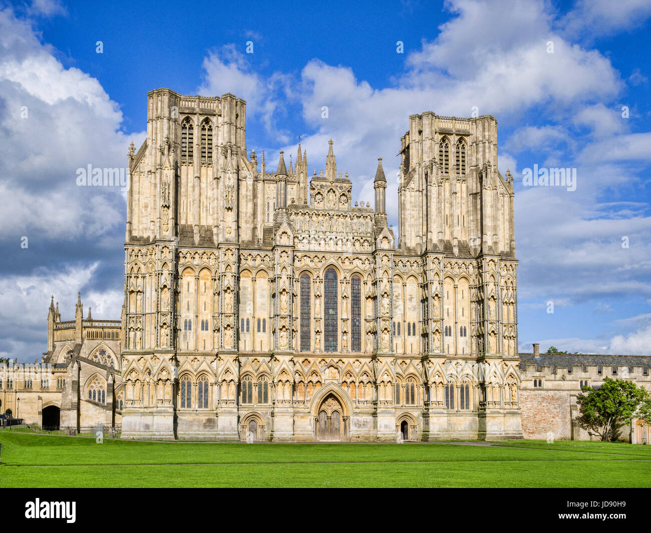 The West Front of Wells Cathedral and Cathedral Green, Wells, Somerset, England, UK. Wells Cathedral is considered to be one of the most beautiful cat Stock Photo