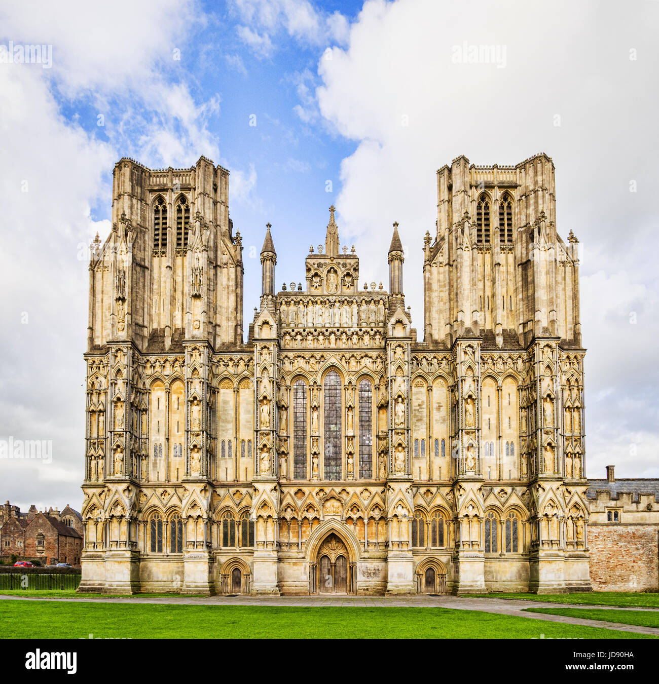 The West Front of Wells Cathedral and Cathedral Green, Wells, Somerset, England, UK. Wells Cathedral is considered to be one of the most beautiful cat Stock Photo