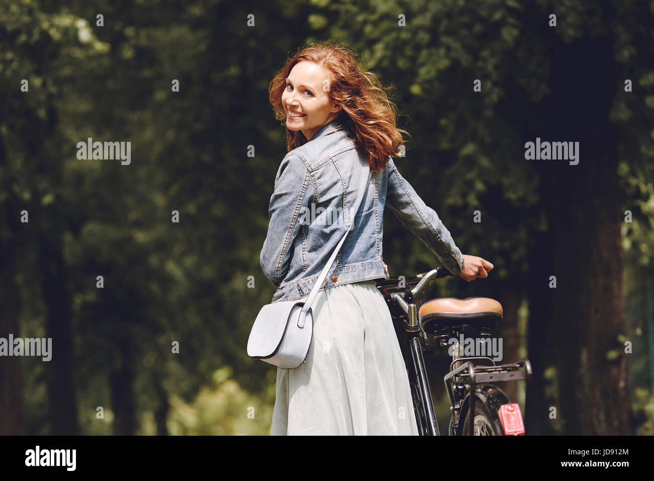 A woman choose a bicycle as a means of transport Stock Photo Alamy