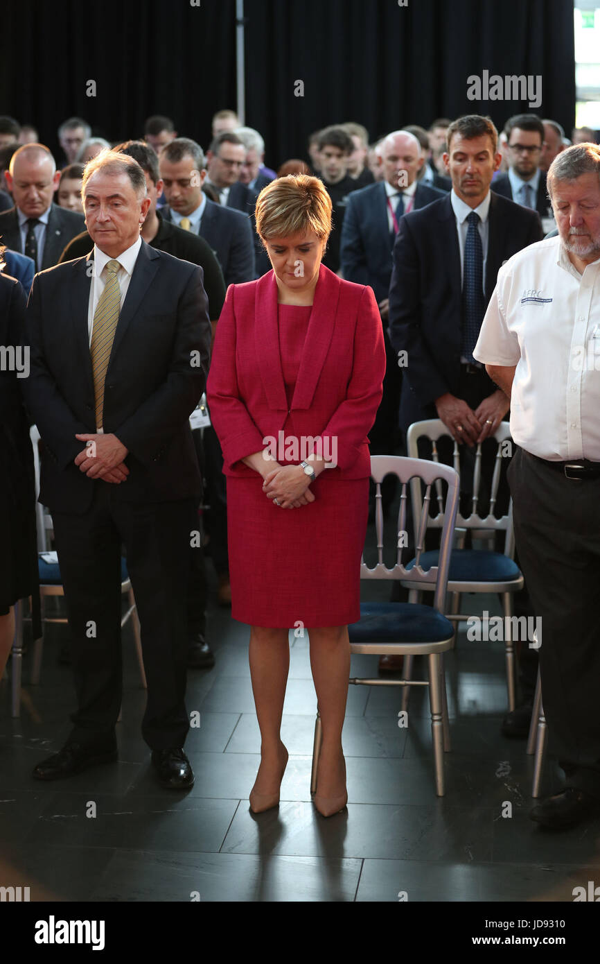 First Minister Nicola Sturgeon observes a minute's silence during a visit to the Advanced Forming Research Centre in Renfrew, Glasgow, in memory of those who died in the Grenfell Tower fire in west London last week. Stock Photo